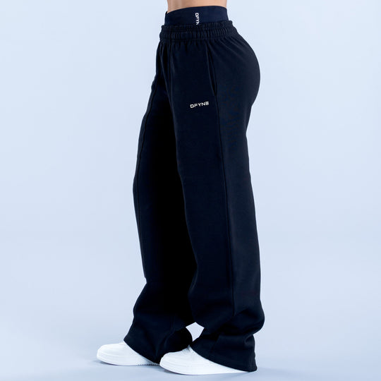 Wide-leg jogger pants in dark navy with side seam detail and small DYFNS logo