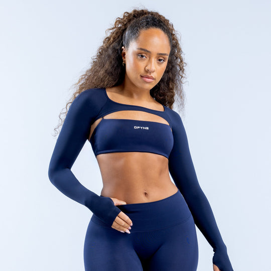 Navy long-sleeve athletic shrug with sports-bra overlay and cropped hem
