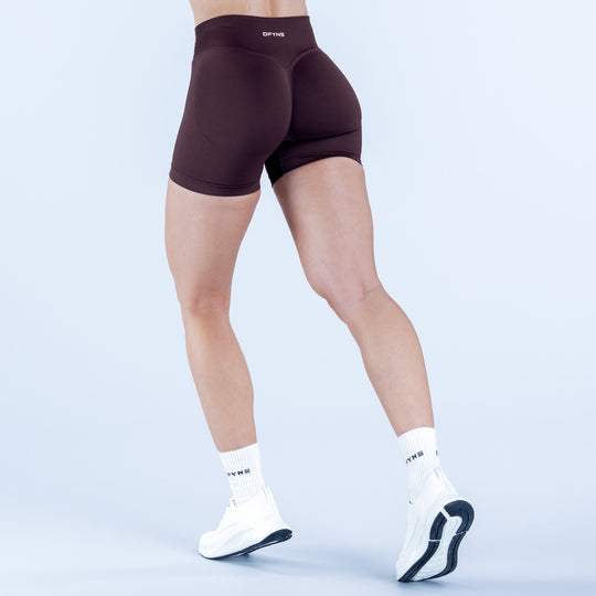 4.5-inch dark plum compression shorts with contoured waistband and leg seams