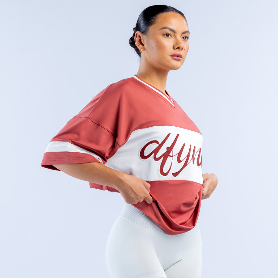 Short-sleeve birthday top, burgundy and white with cursive logo on front