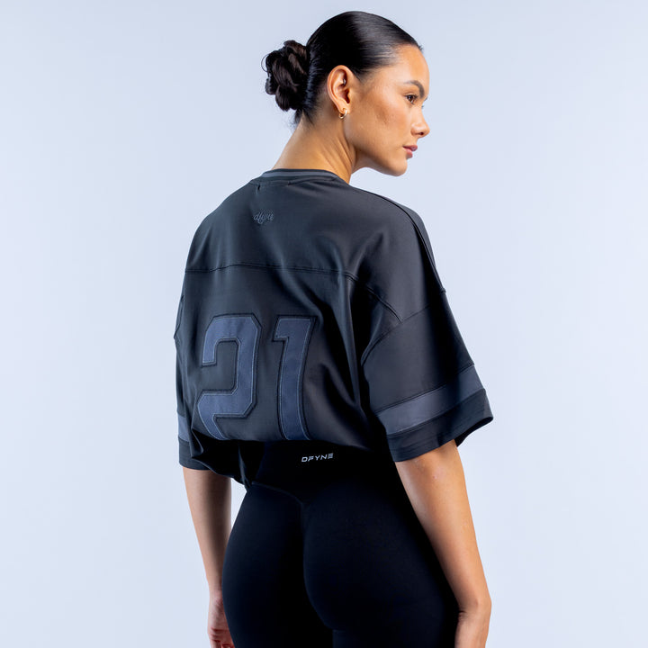 Dark short-sleeve top with large back graphic print and logo detail