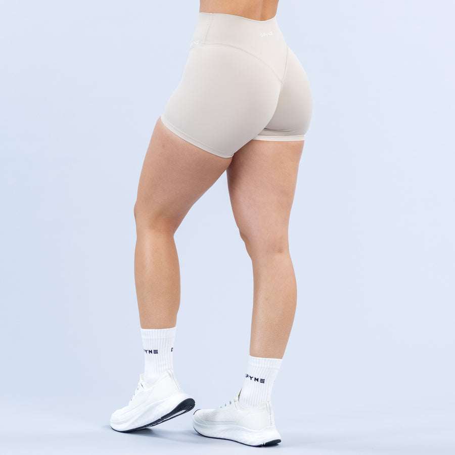 Light beige 4.5-inch athletic shorts, seamless back coverage