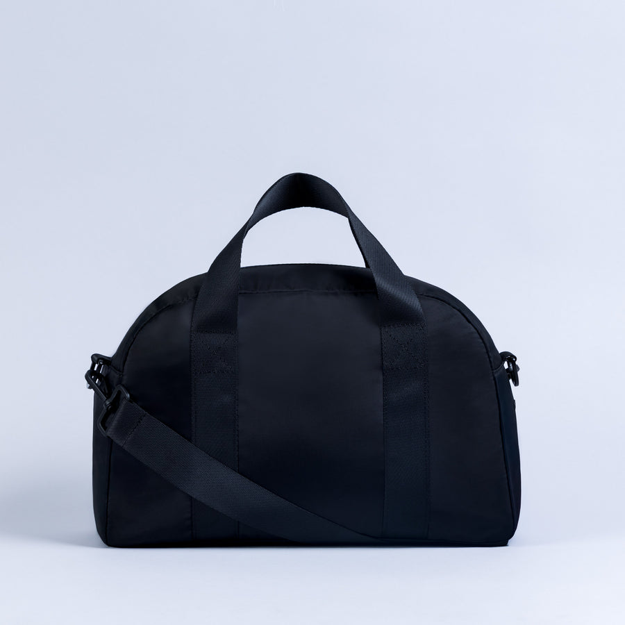 Mini duffle bag with crossbody strap and top carry handles