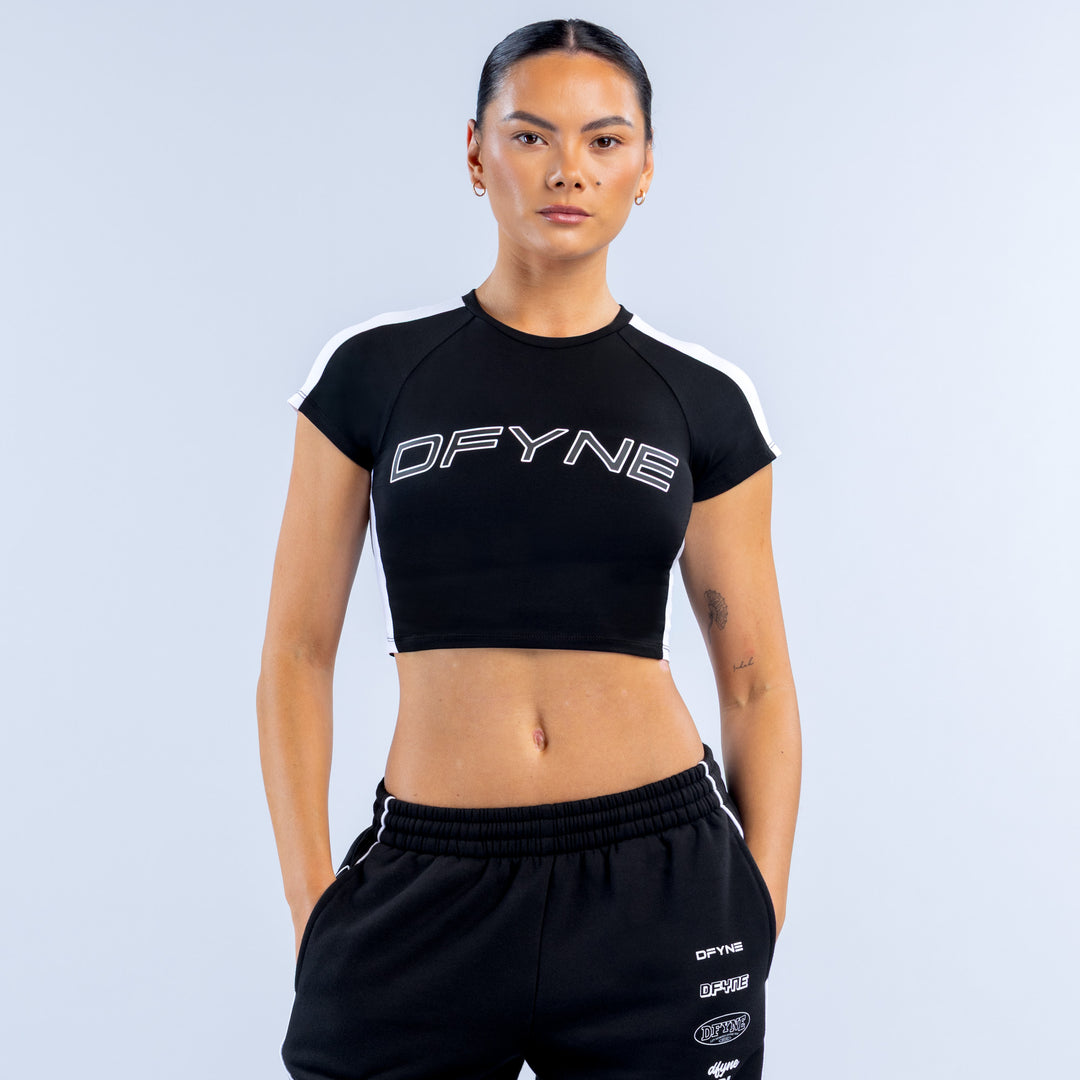 Black baby T-shirt with DFYNE logo, short sleeves, crew neck.