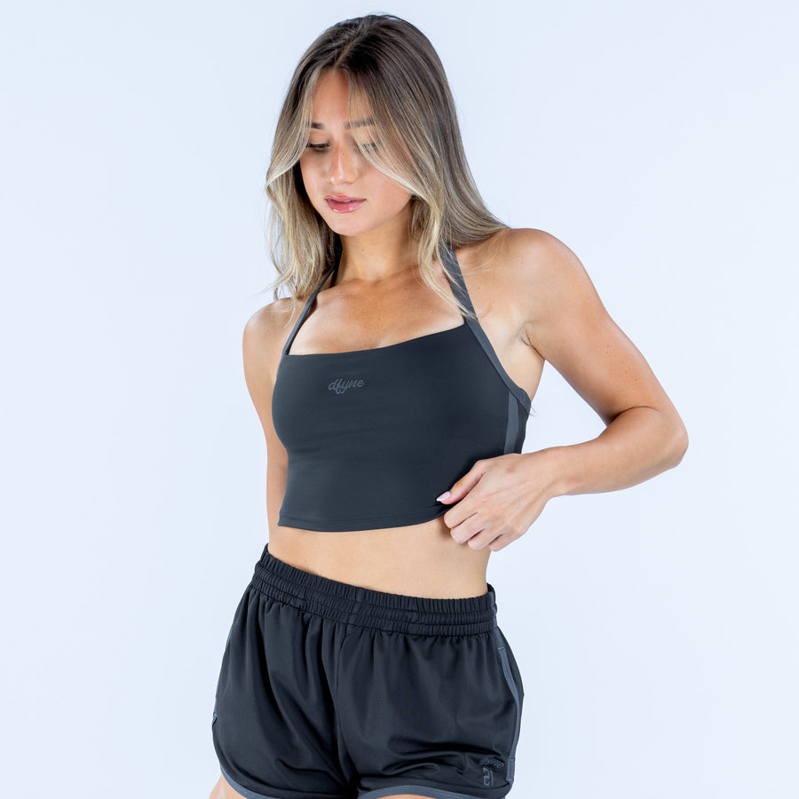 Black halter crop top with racerback straps and fitted straight hem