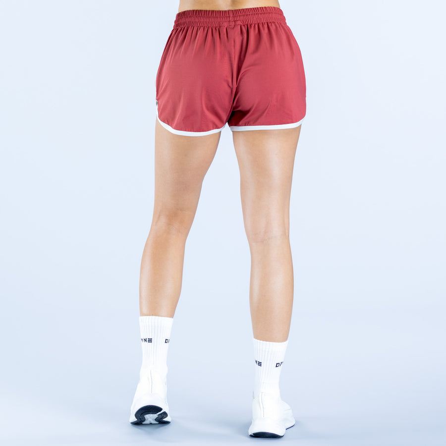 4th birthday shorts with burgundy fabric and white piping around leg openings