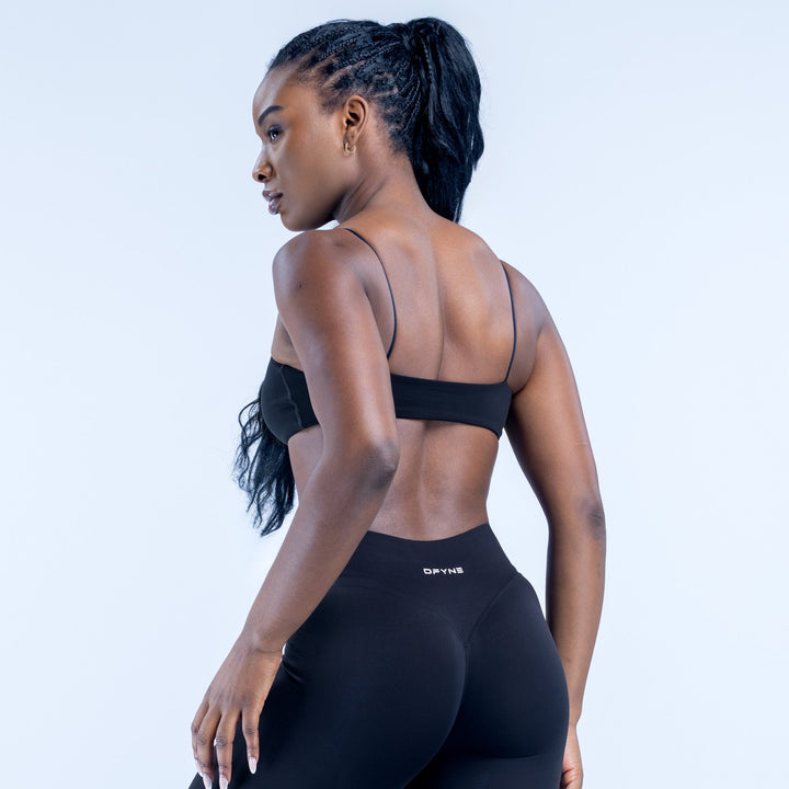 Black strappy bra, racerback with thin straps and DYNE logo on band