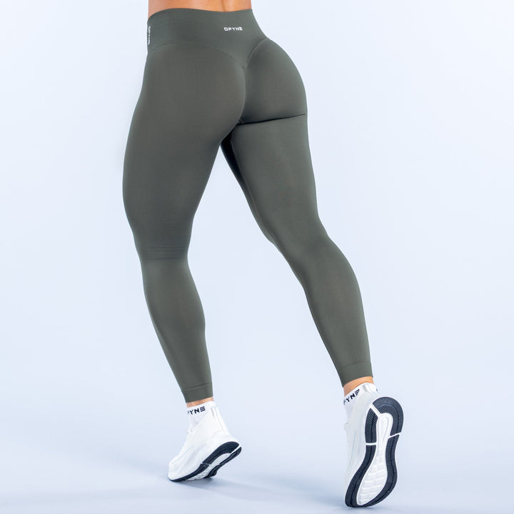 Olive green leggings with waistband logo and full-length stretch knit