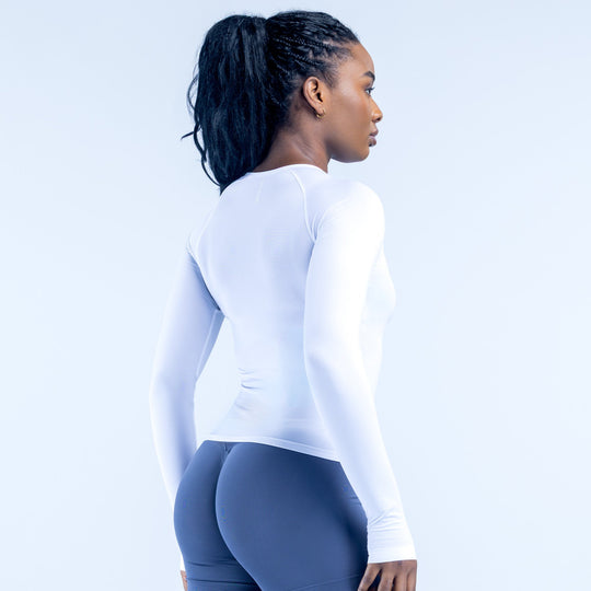 White long-sleeve crew neck top, side view