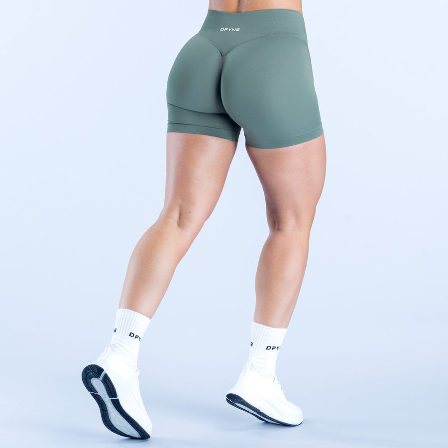 Dark green 4.5-inch athletic shorts with smooth fitted front and back panels