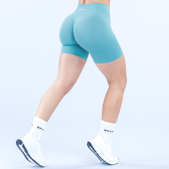 Women’s teal 4.5-inch athletic shorts shown from back, contoured seat