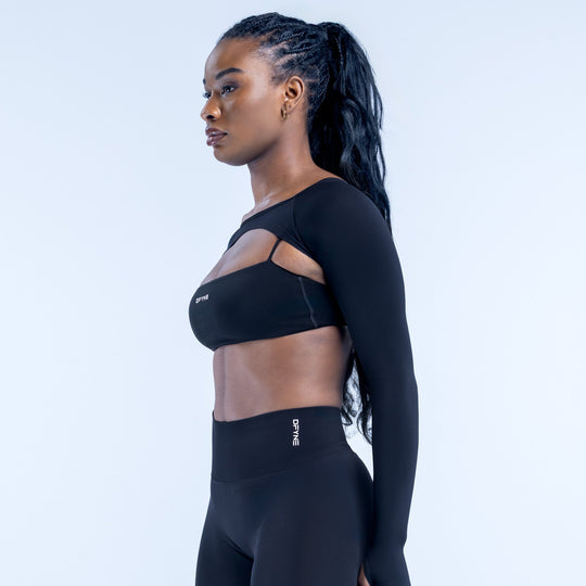 Black long-sleeve shrug top with shoulder cutout and back logo detail