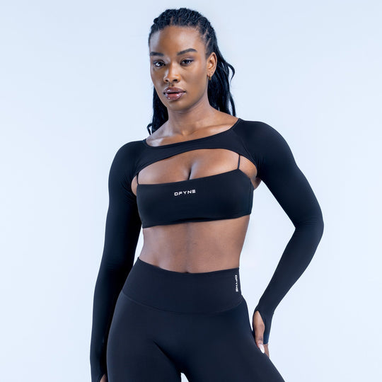 Black long-sleeve shrug crop top with chest neckline cutout and logo band