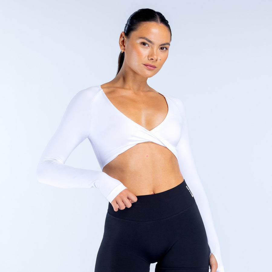 White twist-front V-neck long-sleeve sports top with wrap-style front panel