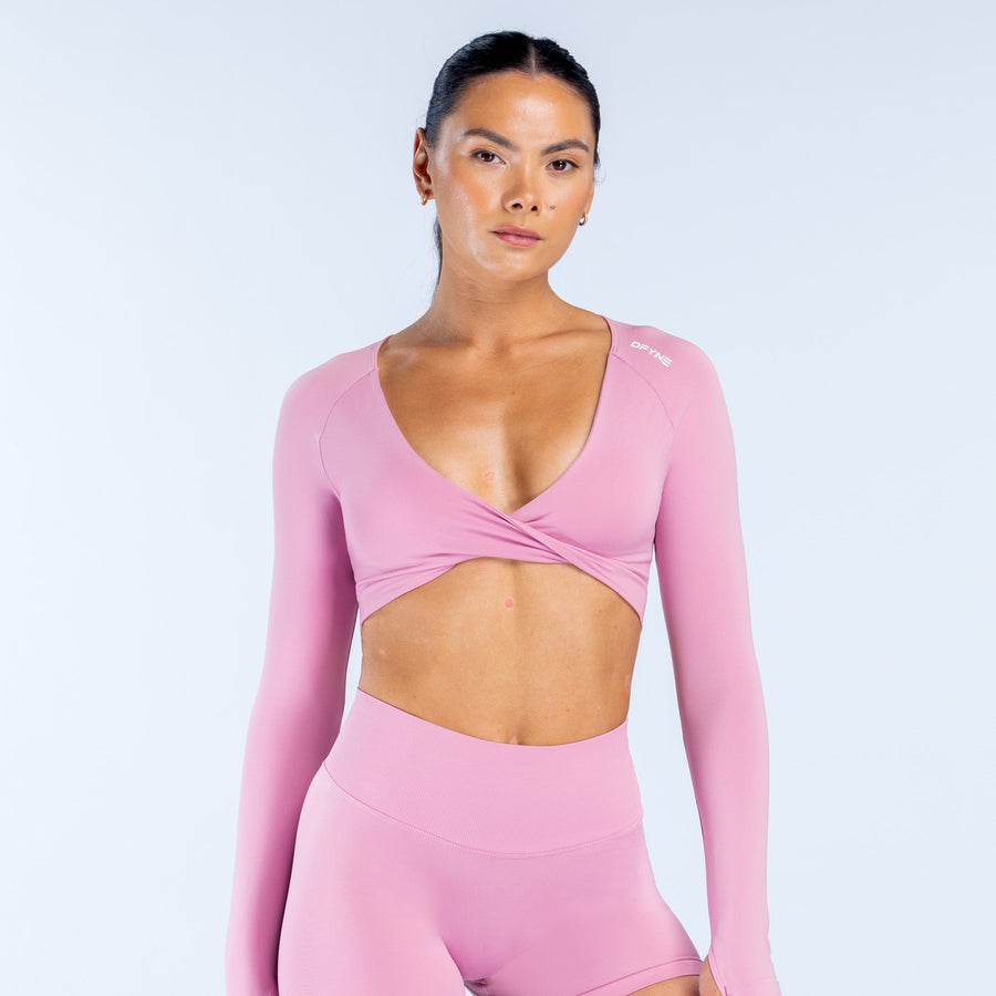 Pink twist-front long-sleeve crop top with V neckline