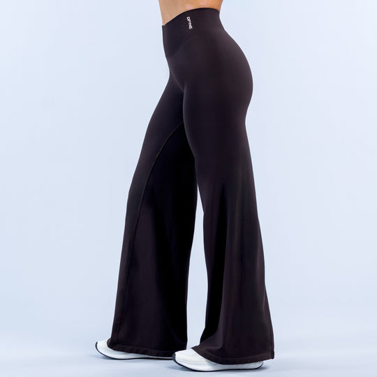 High-waist black flared leggings with subtle waistband logo