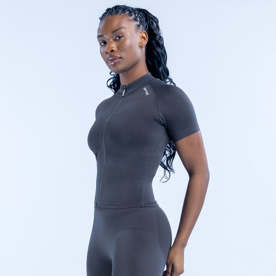 Black short-sleeve zip-up athletic top with raised collar and fitted sleeves