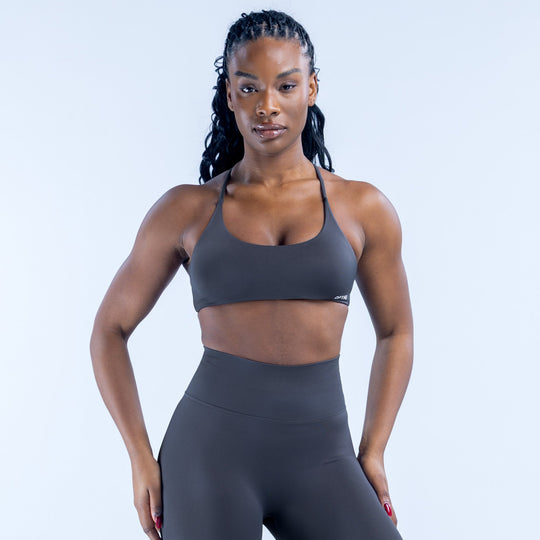 Dark sports bra with thin adjustable straps and scoop front