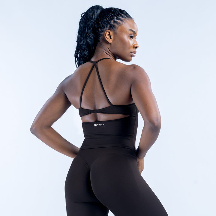 Black twist-back sports top with crisscross shoulder straps and open back