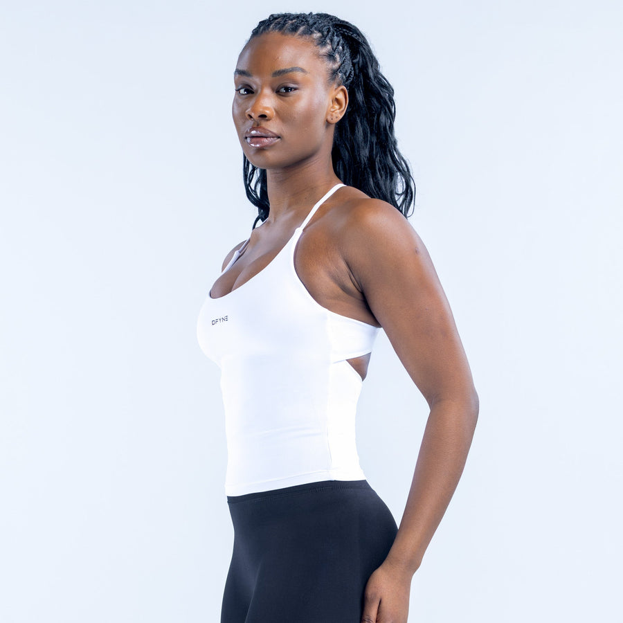 White halter sports top with twist-back straps and fitted body