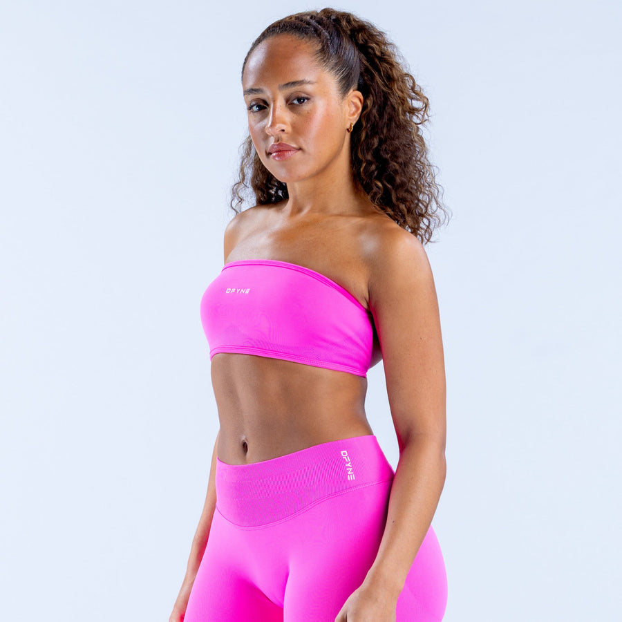 Hot pink bandeau top with wide elastic band and seamless stretch leggings.