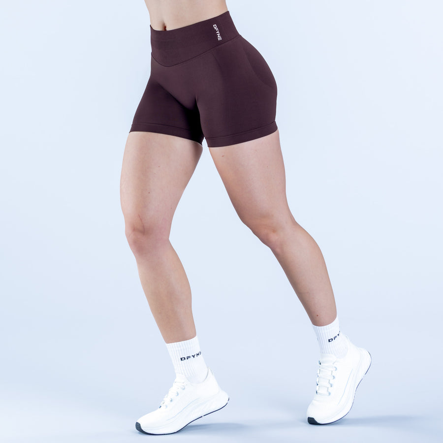 4.5-inch dark plum compression shorts with small logo at waistband