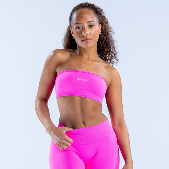 Hot pink backless bandeau top with wide elastic underband, sporty stretch fit.