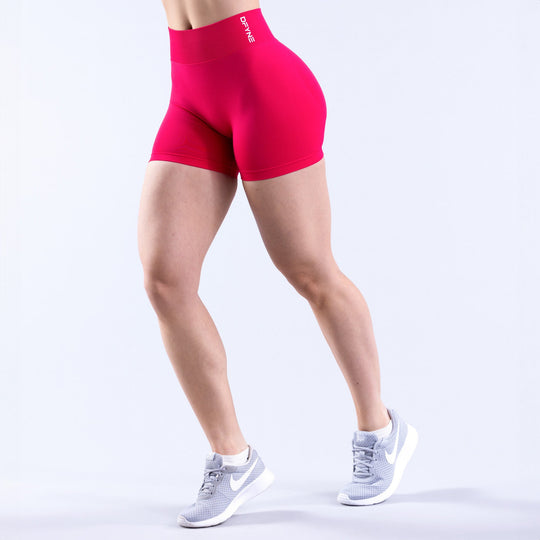 4.5-inch bright pink athletic shorts, fitted with elastic waistband.