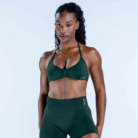 Impact strappy bra in dark green, front view with halter straps and molded cups
