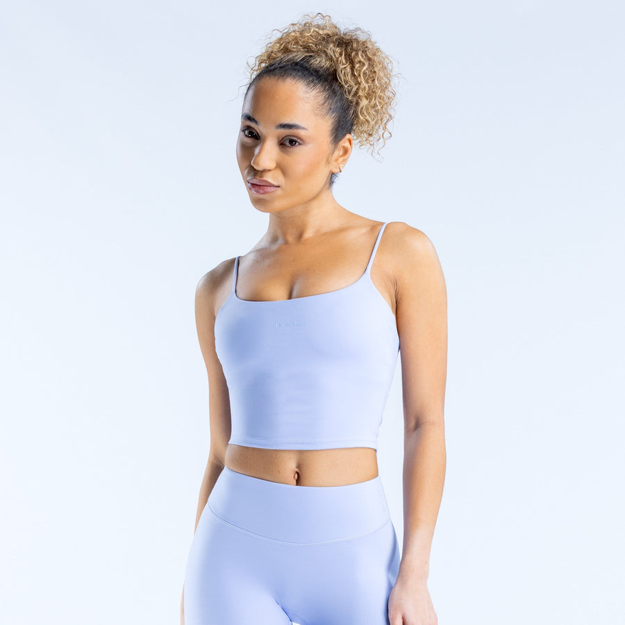 Light blue strappy crop top with square neckline and thin spaghetti straps