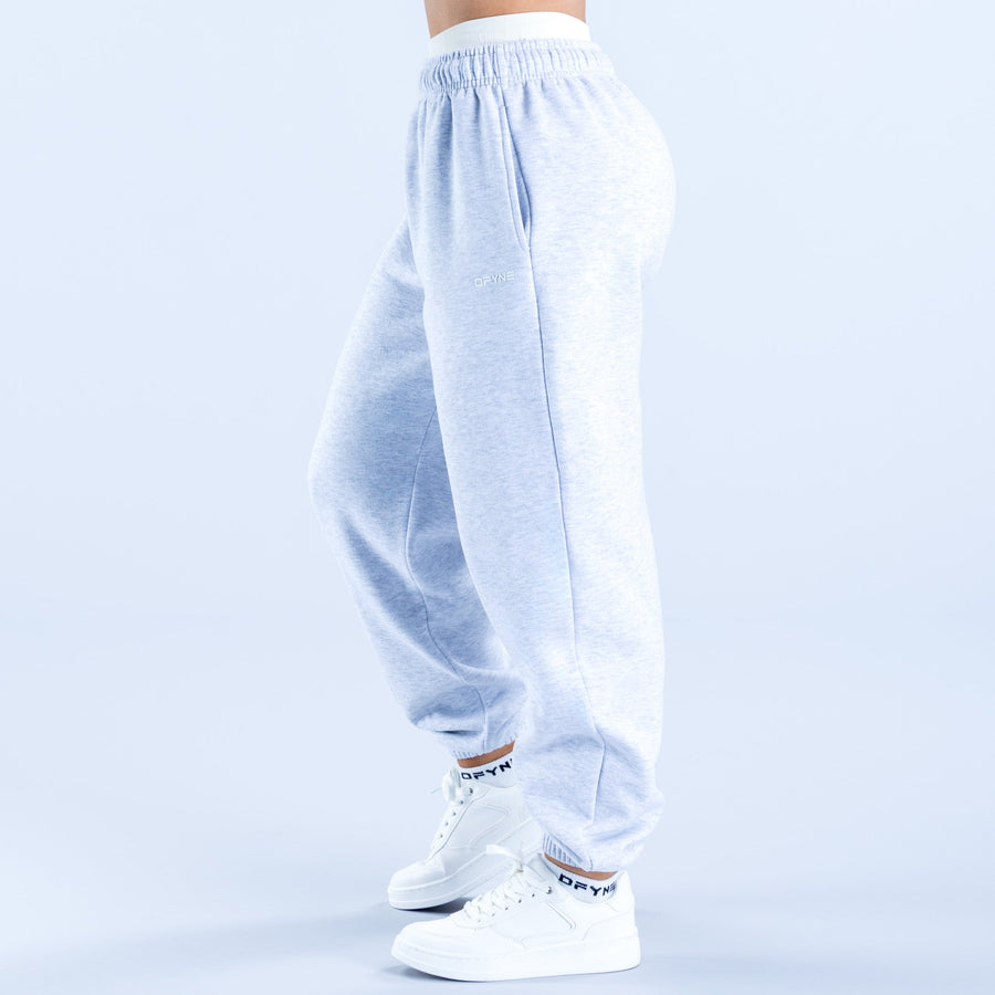 Light blue heather Revive jogger pants, back view with elastic waist and cuffed ankles