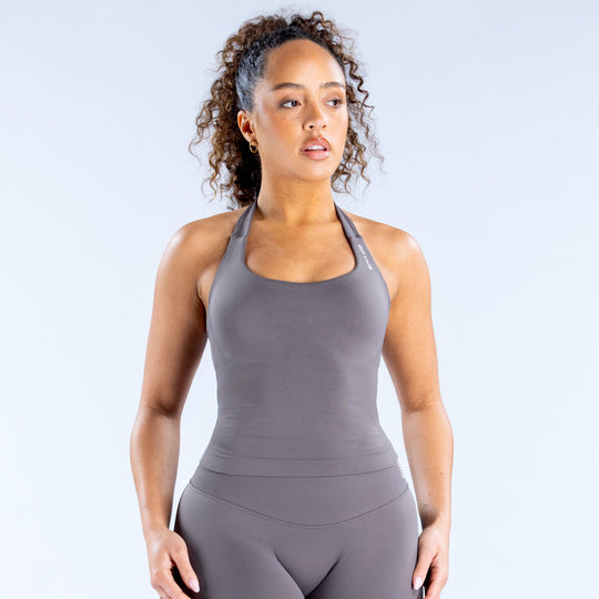 Dark gray halter sports top with racerback and curved hem seams