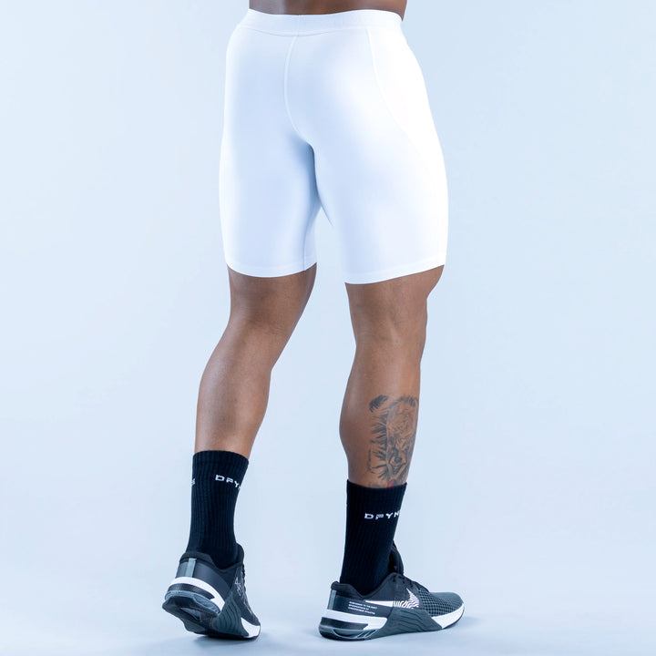 White compression base-layer shorts, knee-length with contoured legs and seam details