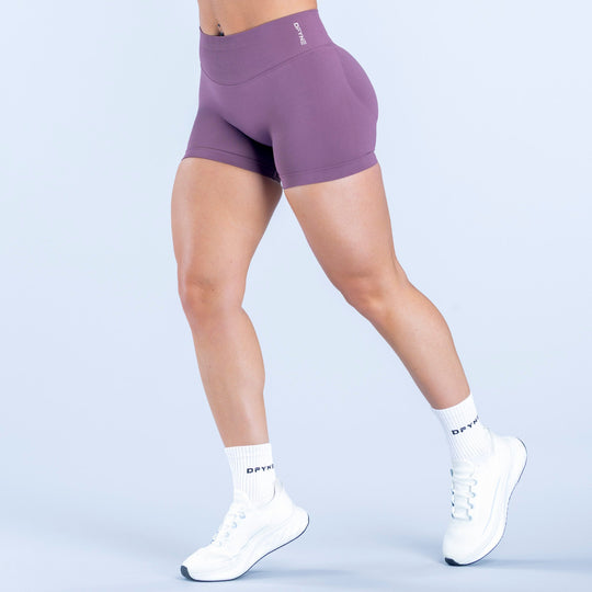Purple 4.5-inch fitted athletic shorts, elastic waistband, no visible pockets