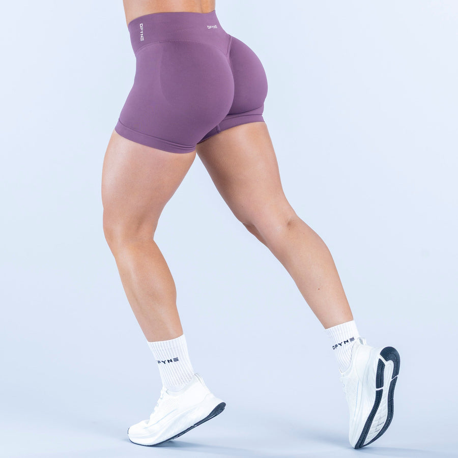 Purple 4.5-inch fitted athletic shorts, elastic waistband, rear view