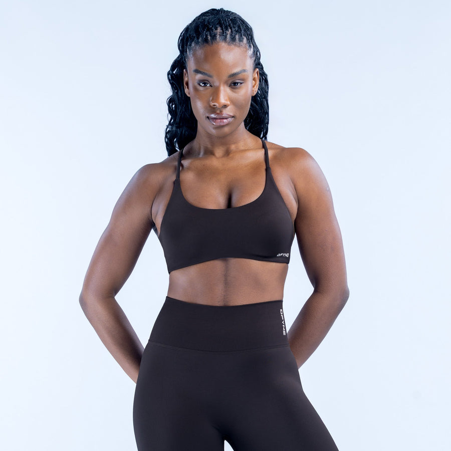 Black sports bra with wide straps and supportive twisted-back design