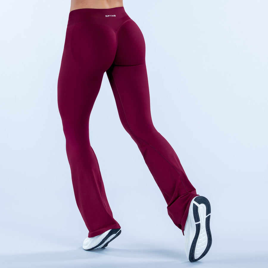 Impact flares in deep burgundy with small waistband logo and flared cuffs