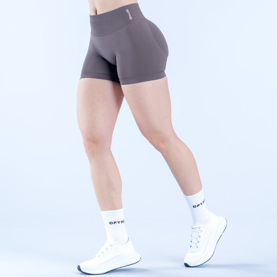 Impact shorts, 4.5-inch fitted compression in dark gray, side view with logo waistband.