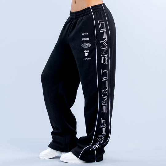 Dark joggers with elastic waistband and large white “DPR” side stripe print