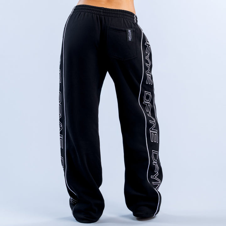 Black wide-leg joggers with elastic waist, back pocket, and white side text print