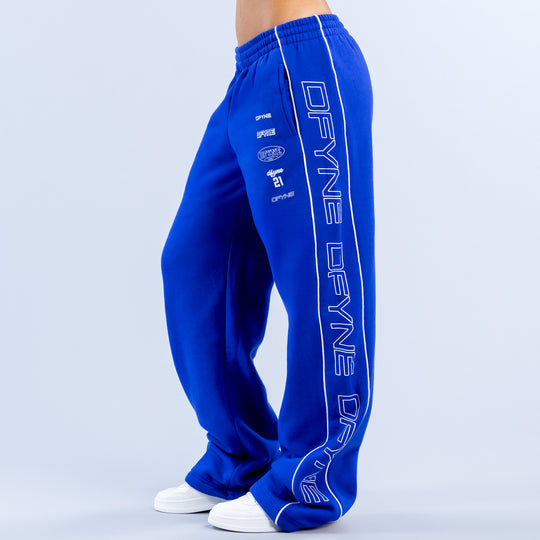 Blue wide-leg jogger pants with elastic waistband and bold side graphic lettering