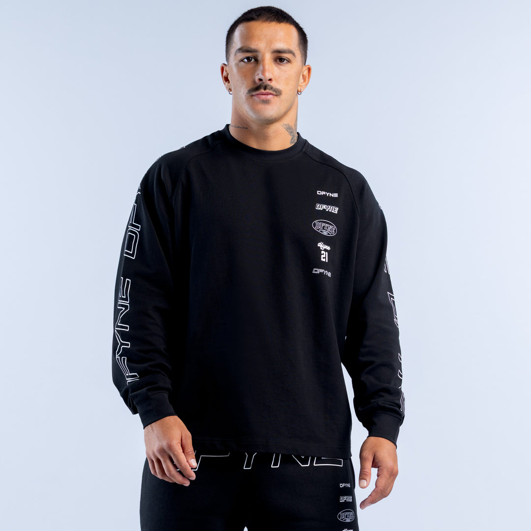 Black long-sleeve crewneck top with white sleeve lettering and small chest logos