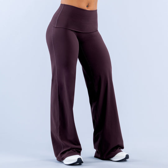 Purple wide-leg pants with fold-over waistband and relaxed straight-leg silhouette