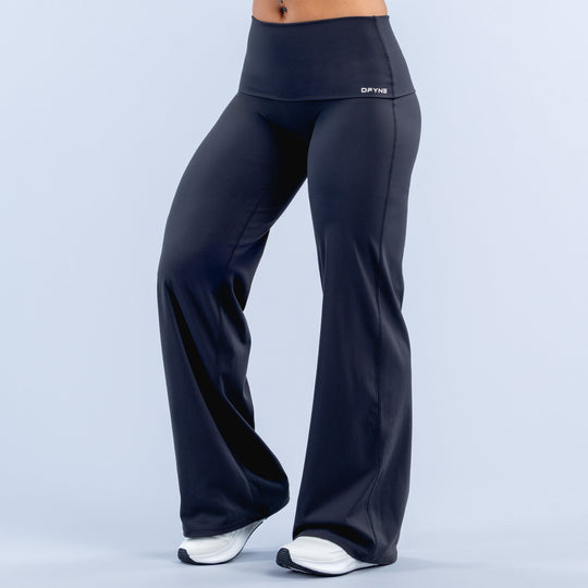 Dark navy wide-leg pants with fold-over waistband, full-length flared legs