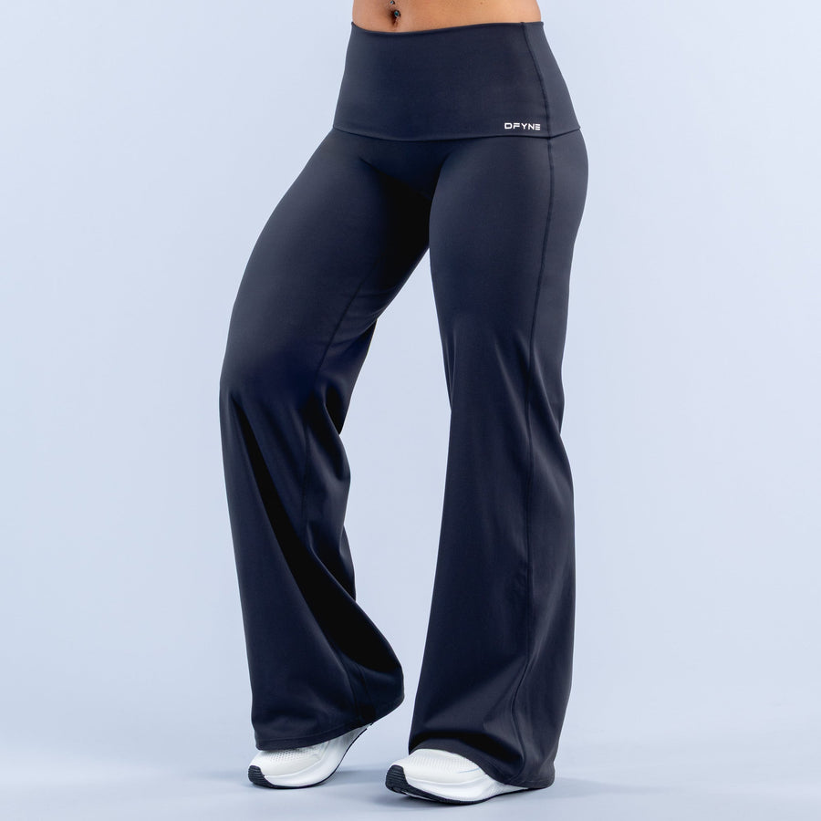 Dark navy wide-leg pants with fold-over waistband, full-length flared legs