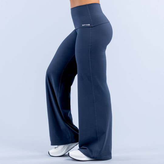 Navy fold-over wide-leg pants with wide flare, smooth seams, and high-rise waistband