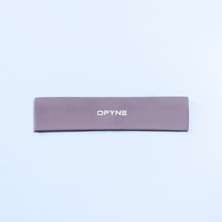 Mauve Origin headband with DFYNE logo, flat lay.