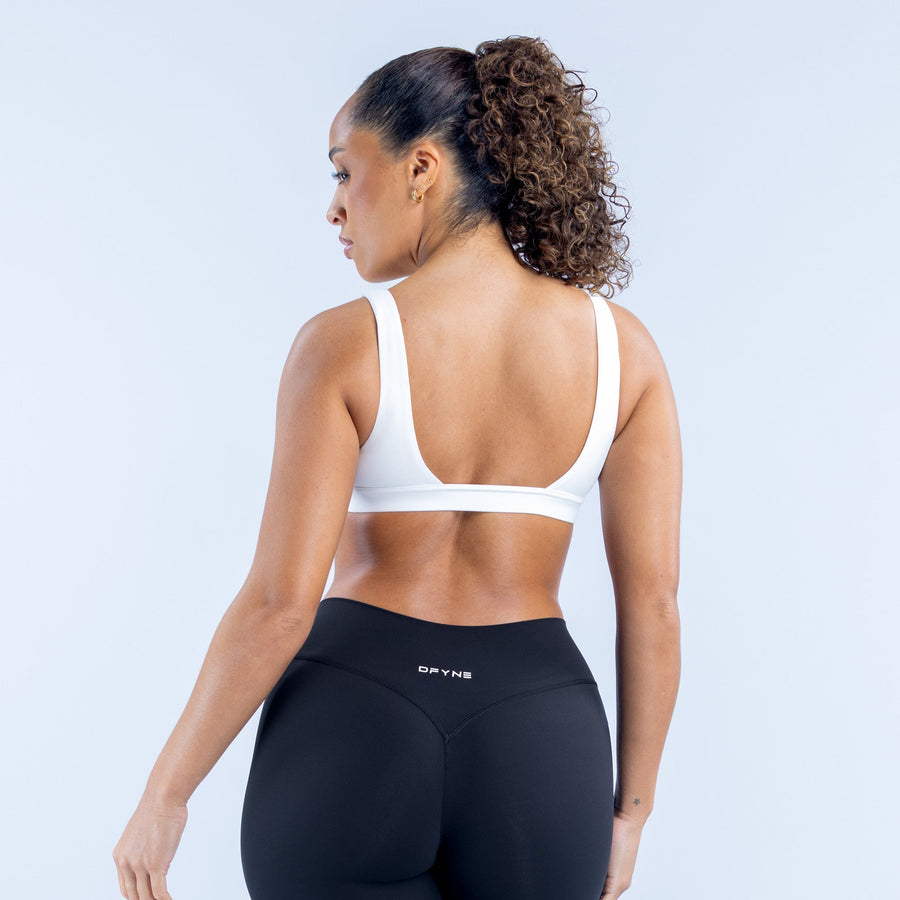 White minimal sports bra, open-back racerback design