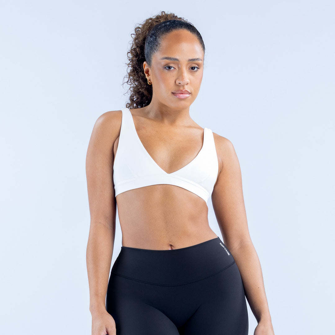 White minimal V-neck sports bra with racerback straps
