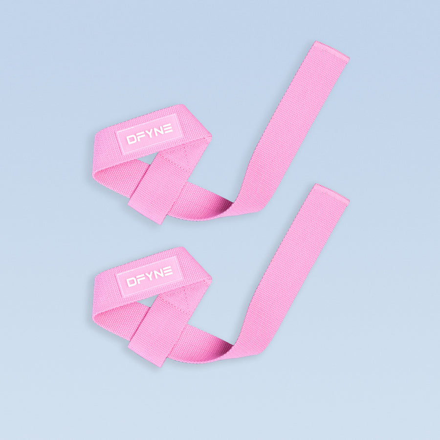 Pink wrist straps with DYNE logo, adjustable wide webbing.